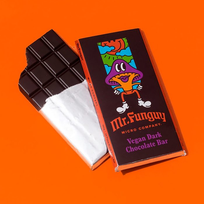 Mr. Funguy Vegan Dark Milk Chocolate Bar package with bar on orange background